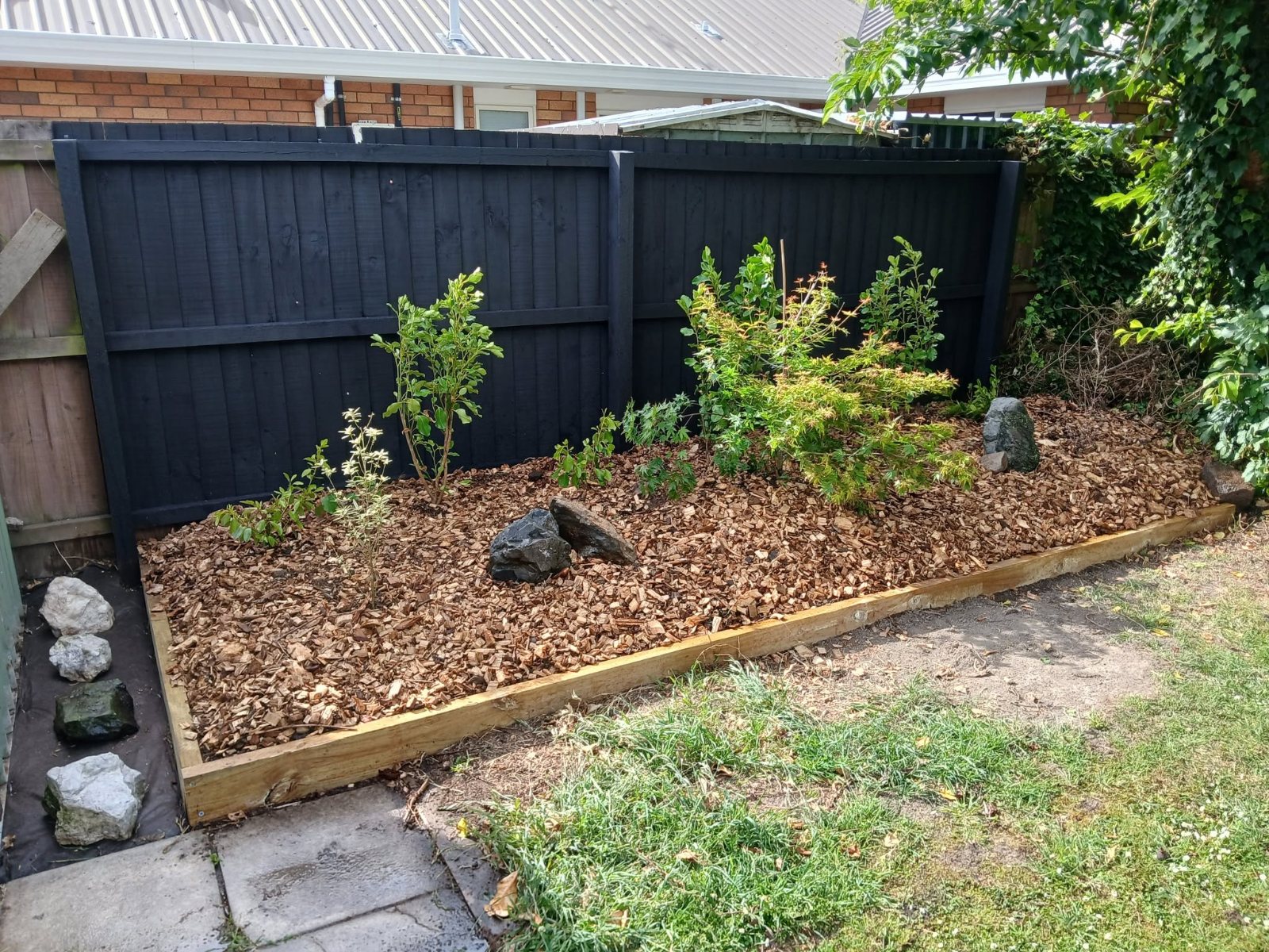 New garden bed and painted fence built by Edge Property Care, Christchurch